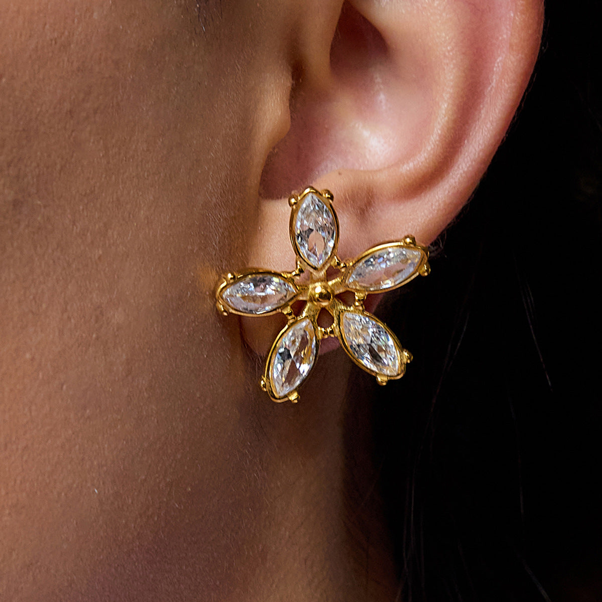 Clear stone flower stud earrings side angle