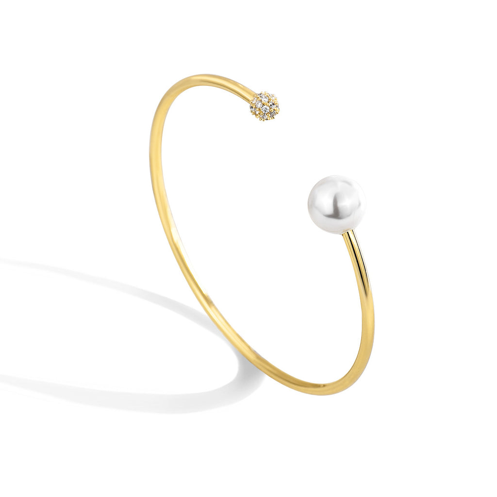 angled catalog view of asymmetrical gold plated open bangle