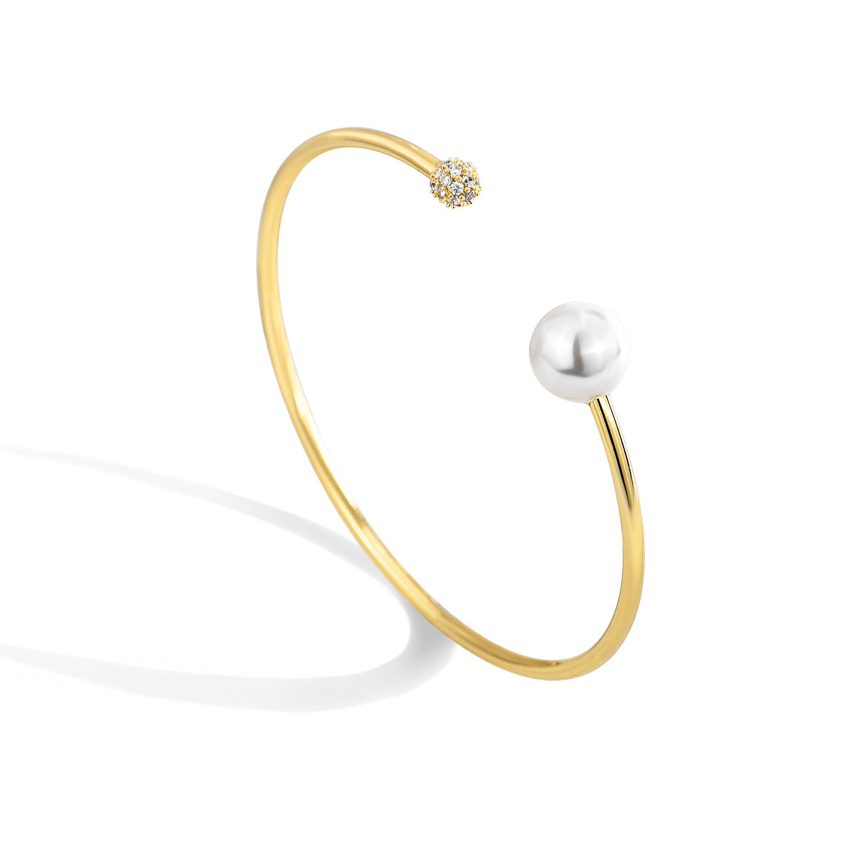 angled catalog view of asymmetrical gold plated open bangle