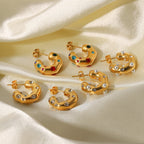 Three decorated hoop styles arranged on beige fabric