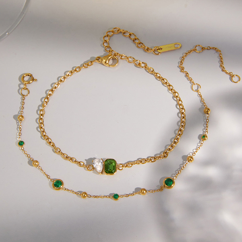 Station and three-stone bracelets laid together