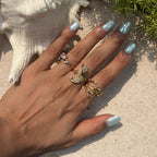 Three coastal ring silhouettes styled outdoors