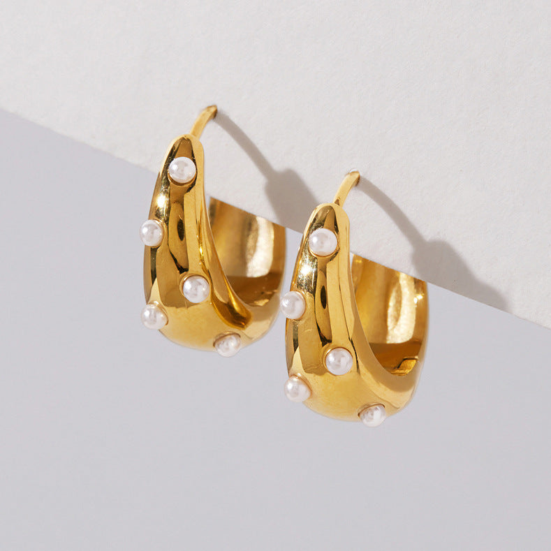 Tapered gold-tone hoops with scattered white pearl accents