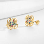 close view of gold plated clover studs and ball backs