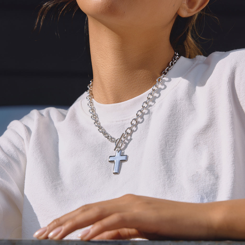 silver-finish cross toggle chain necklace worn on model