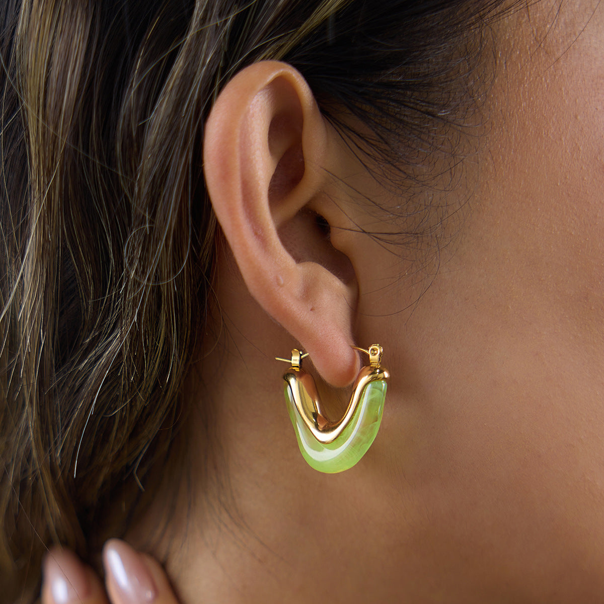 Green U-shaped resin hoop on a lobe