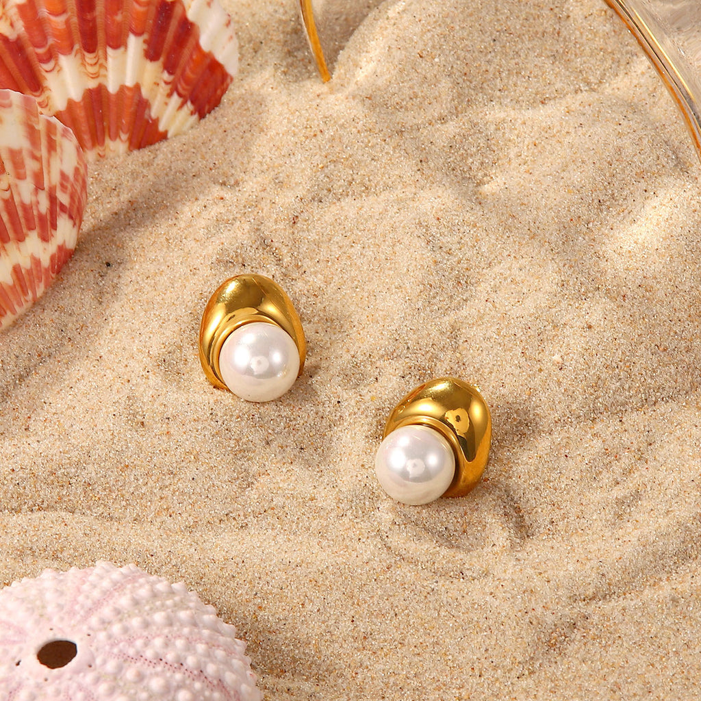 white pearl and gold plated sculptural studs styled on sand