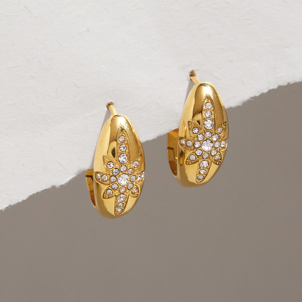 Gold-tone oval hoops with rhinestone starburst fronts
