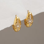 Gold-tone oval hoops with rhinestone starburst fronts