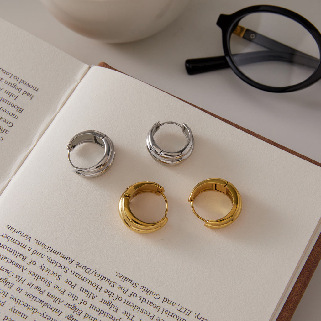 polished triple-ridge hoop earrings displayed in two finishes