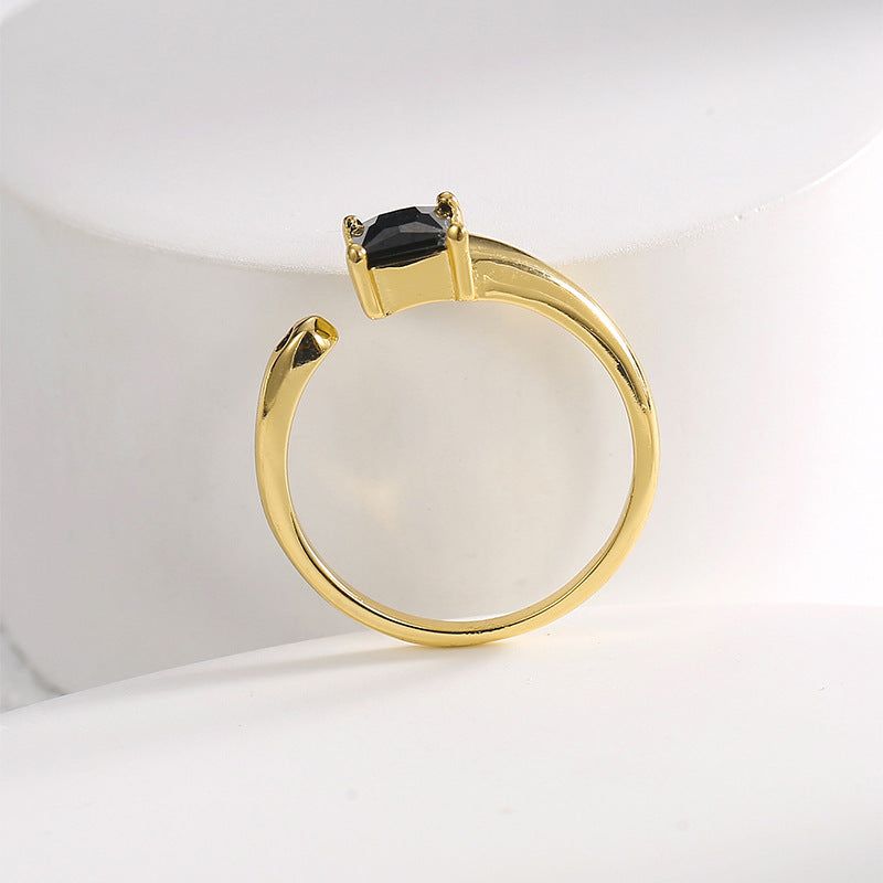 top view of the asymmetric open band and two black stone tips