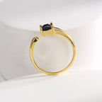 top view of the asymmetric open band and two black stone tips