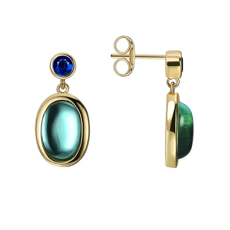 front and side view of oval blue glass drop earrings