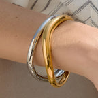 Close-up of smooth polished bangles on a wrist
