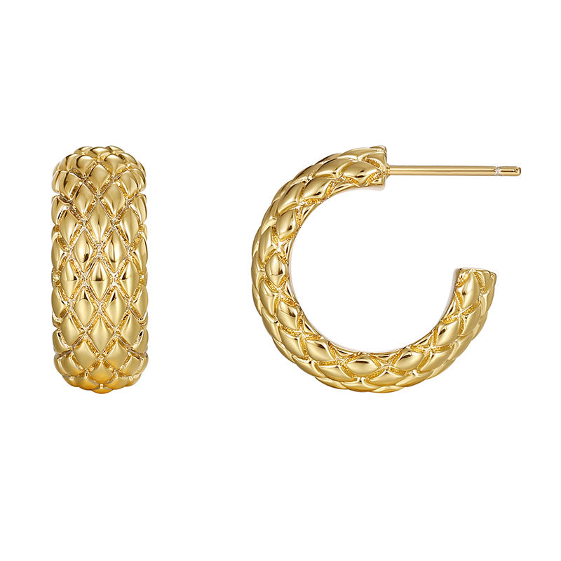 front and side views of openwork gold plated C hoop earrings