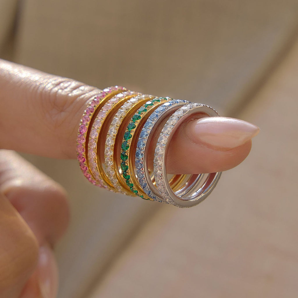 Colored stone stacking rings arranged on a finger