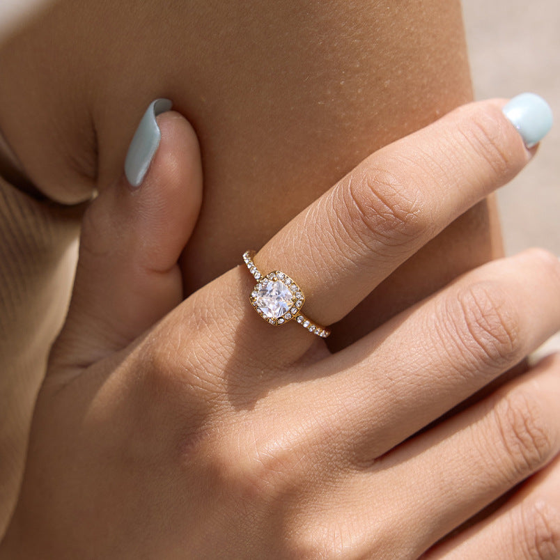 Cushion-shaped halo ring shown on finger