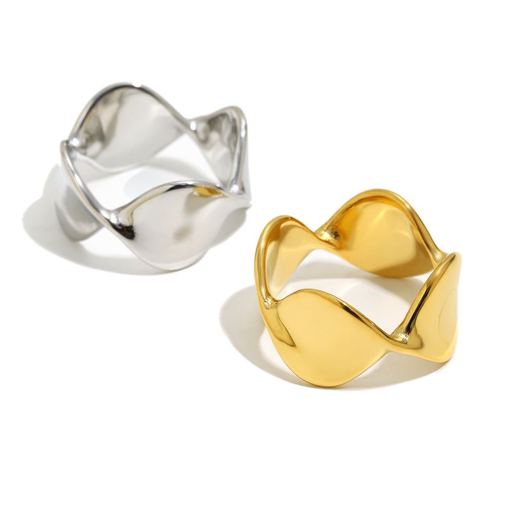 paired sculptural wave rings with flowing open silhouettes