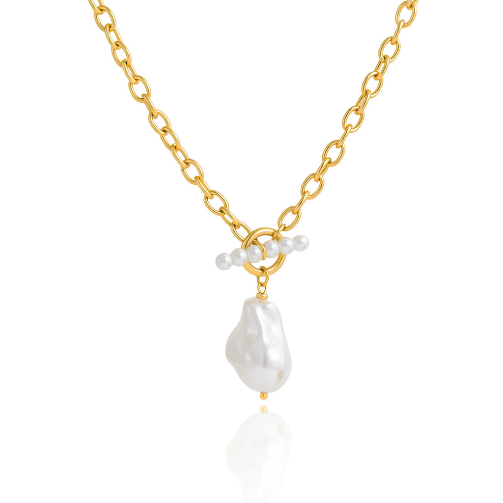 Irregular white imitation pearl beneath a toggle bar