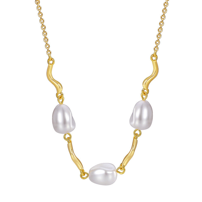 front detail of gray pearl and wave-link necklace