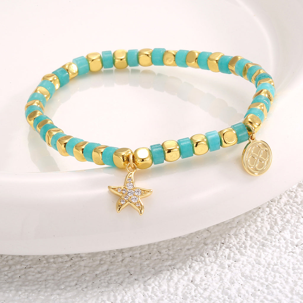 angled view of the gold plated starfish beaded bracelet