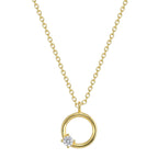 isolated open circle pendant with offset clear stone