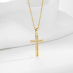 cross pendant with narrow inset stone row on gold plated chain