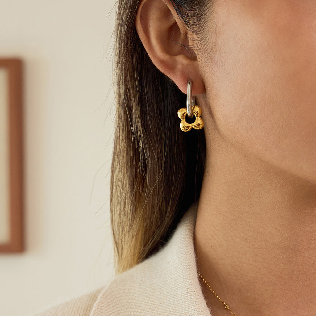 Two-Tone Floral Charm Stainless Steel Huggie Earrings — side view showing the rectangular hoop