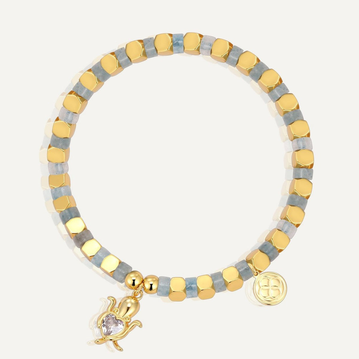 gold plated sea turtle bracelet with blue-gray cube beads