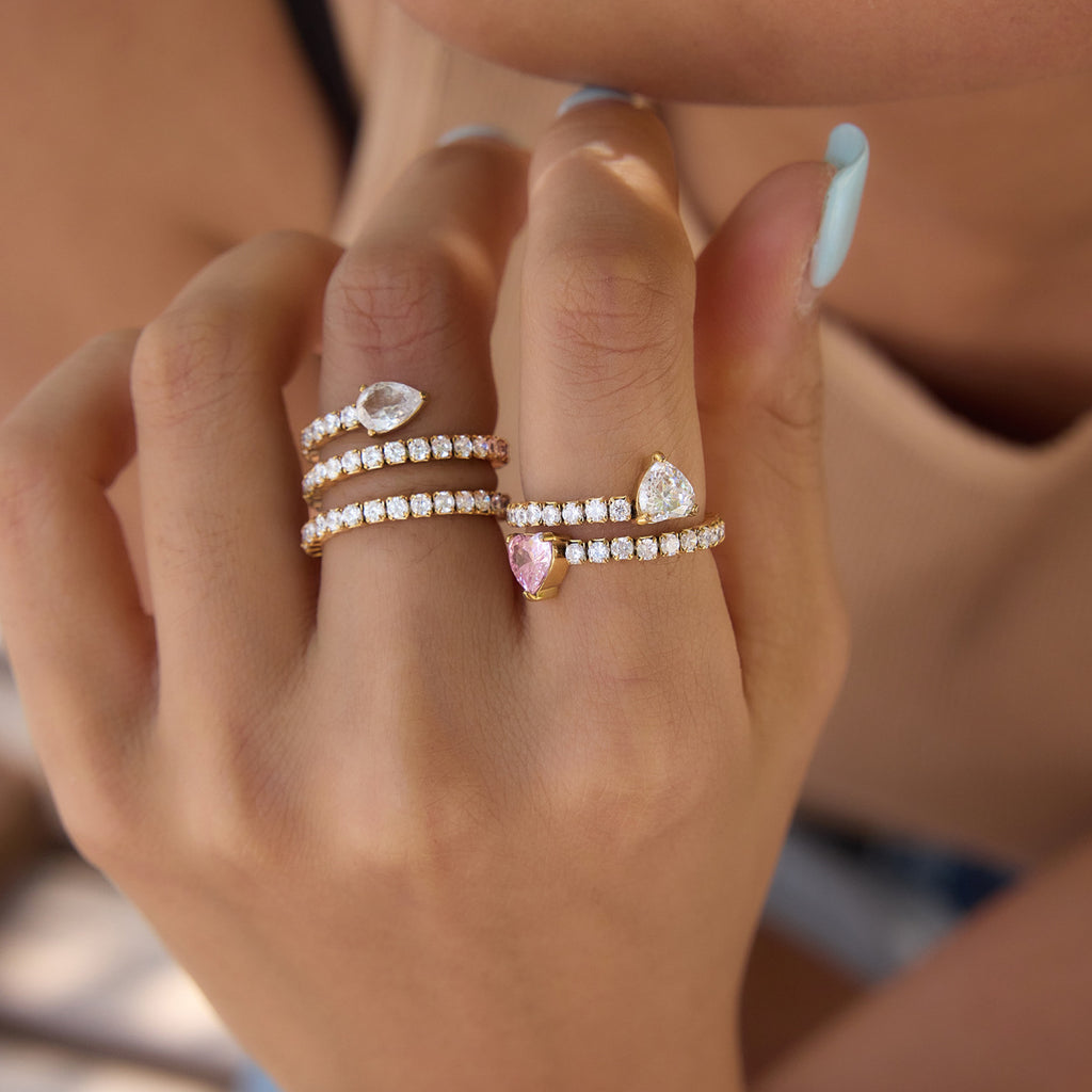 Clear and pink-accent wrap rings worn together