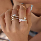 Clear and pink-accent wrap rings worn together