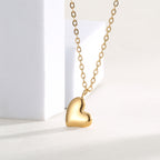 angled studio view of the smooth off-center heart pendant