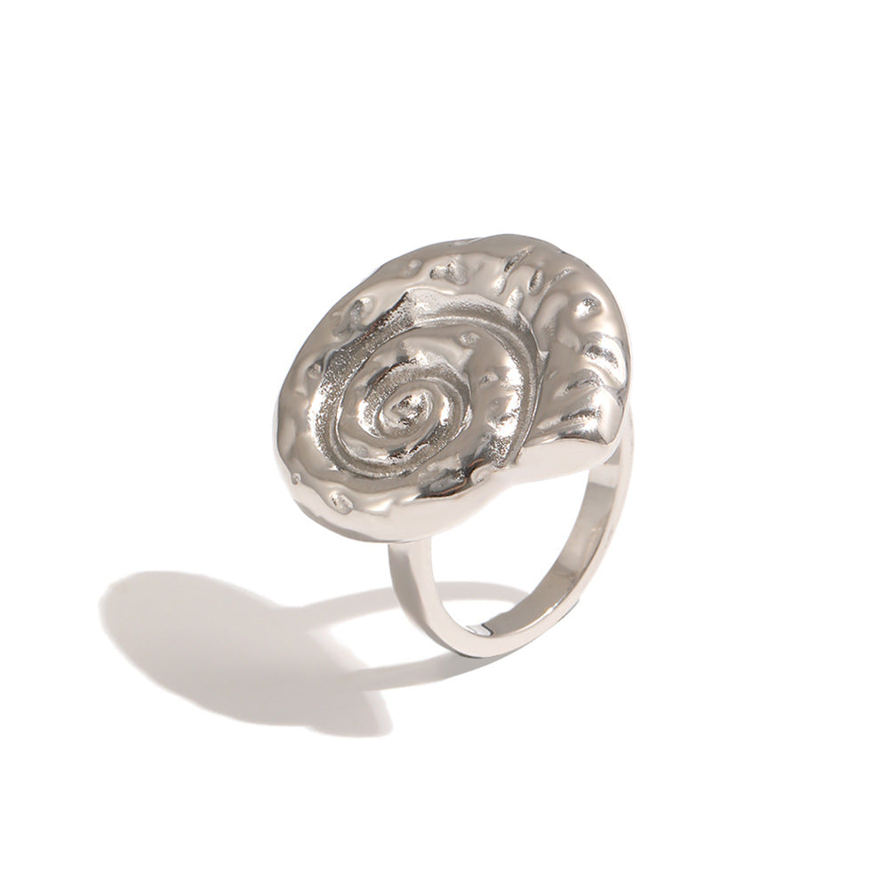 Silver tone spiral shell ring shown from front angle