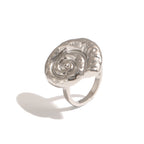 Silver tone spiral shell ring shown from front angle