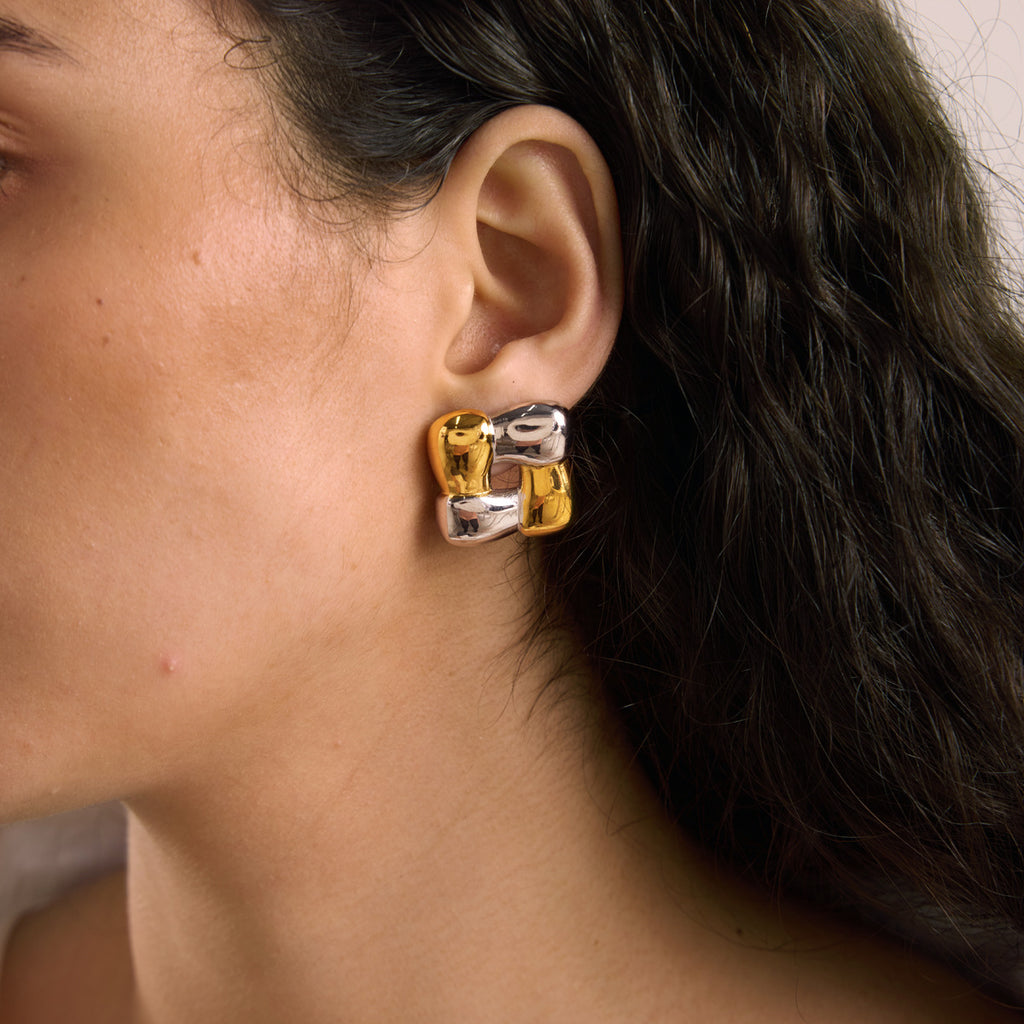 Two tone open square earring shown in profile