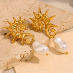 seahorse pearl drop earrings arranged on a beige stone surface