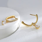 gold plated huggie drop earrings with pear-cut clear stone