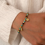 model wearing the gold plated coastal bead charm bracelet