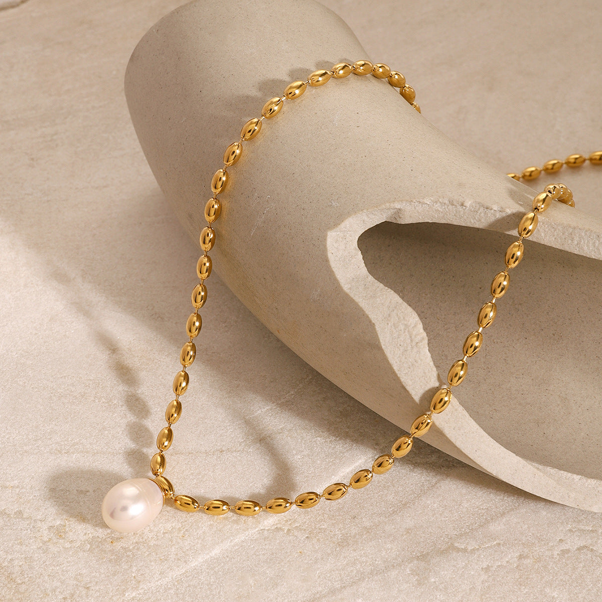 Gold-Tone Pearl-Look Stainless Steel Necklace Collection on-model view