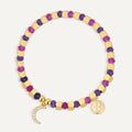gold plated crescent moon bracelet with purple and magenta beads