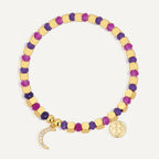 gold plated crescent moon bracelet with purple and magenta beads