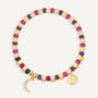 gold plated crescent moon bracelet with purple and magenta beads