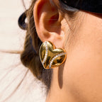 side view of the folded ribbon-like heart stud earring