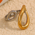 two-tone stainless steel open ring with overlapping teardrop ends