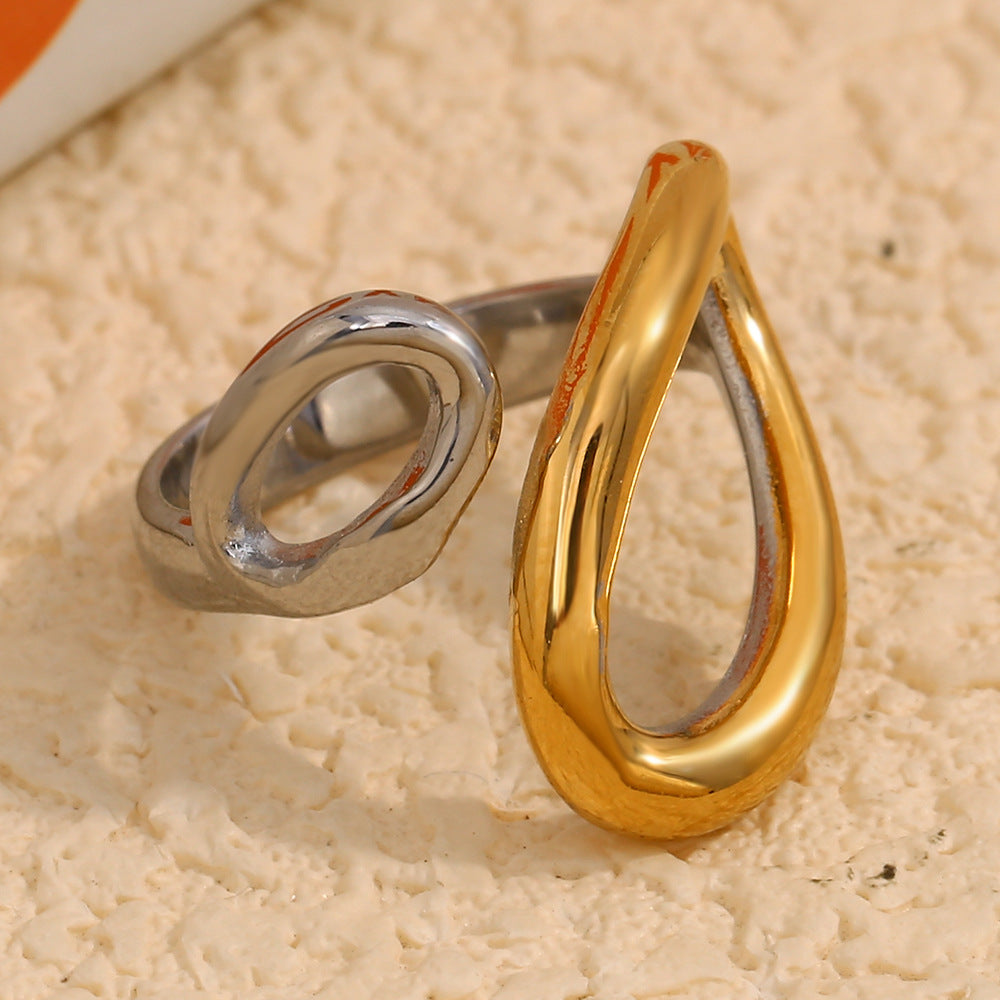 two-tone stainless steel open ring with overlapping teardrop ends