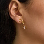 Gold tone loop and zirconia drop shown in profile