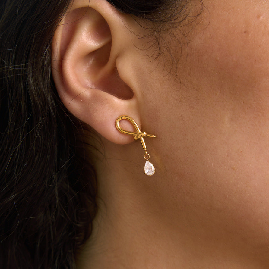 Gold tone loop and zirconia drop shown in profile
