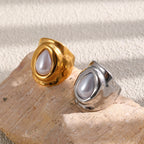 Two ring finishes displayed on a wooden block