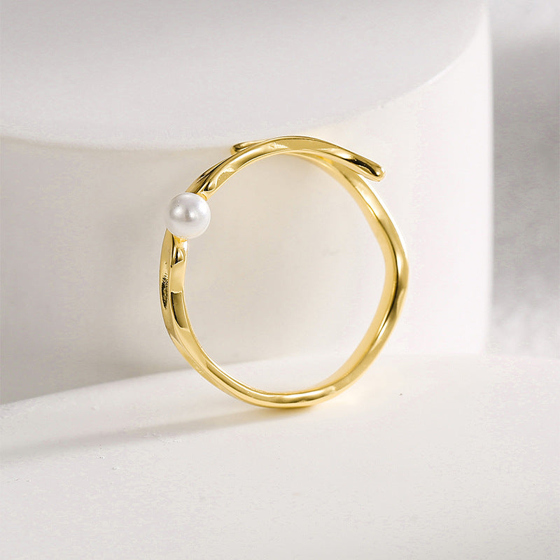 top view of the polished gold plated shell pearl ring