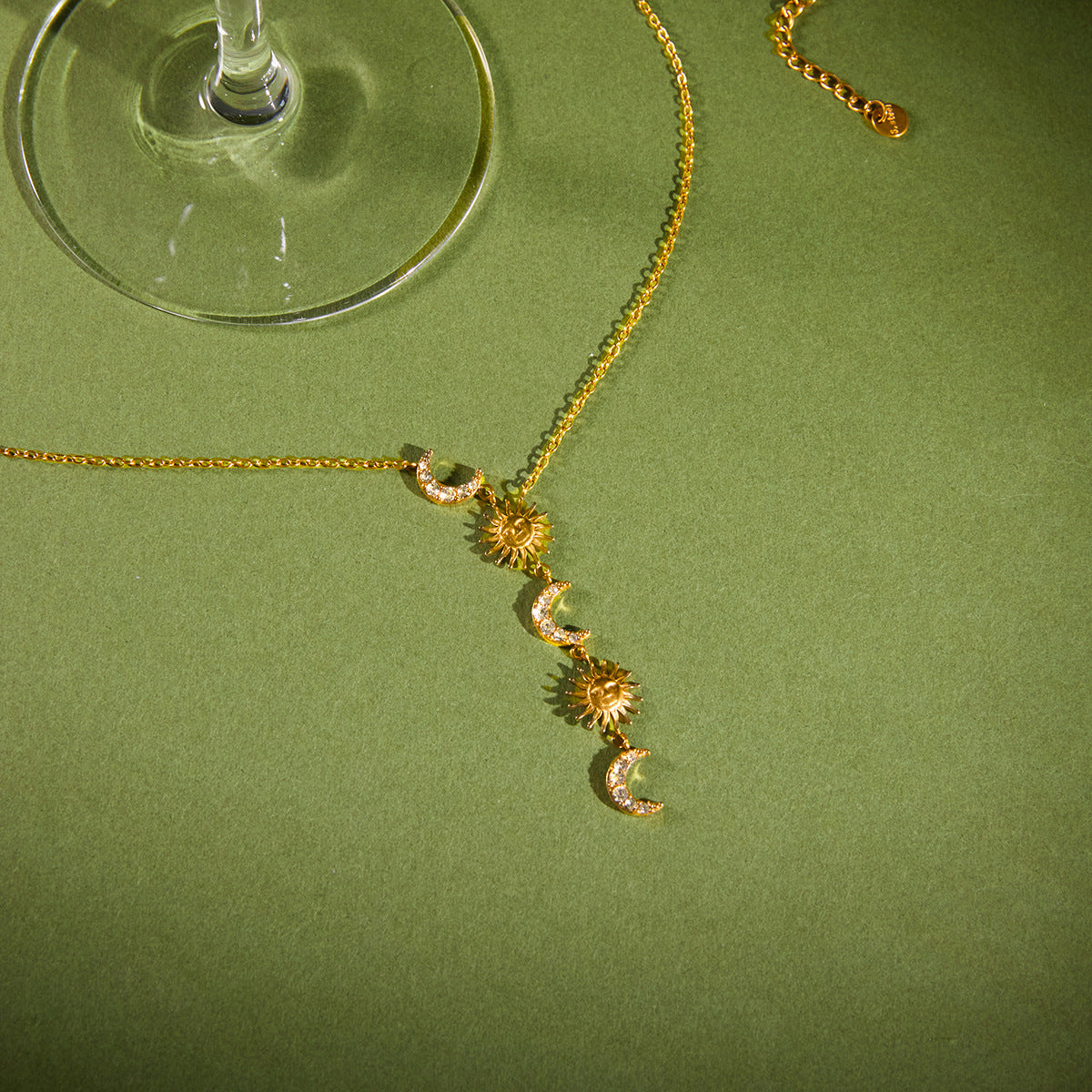 Close-up of alternating sunbursts and clear-stone crescent moons